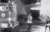 Fire Policeman cooling down an appliance during a building fire